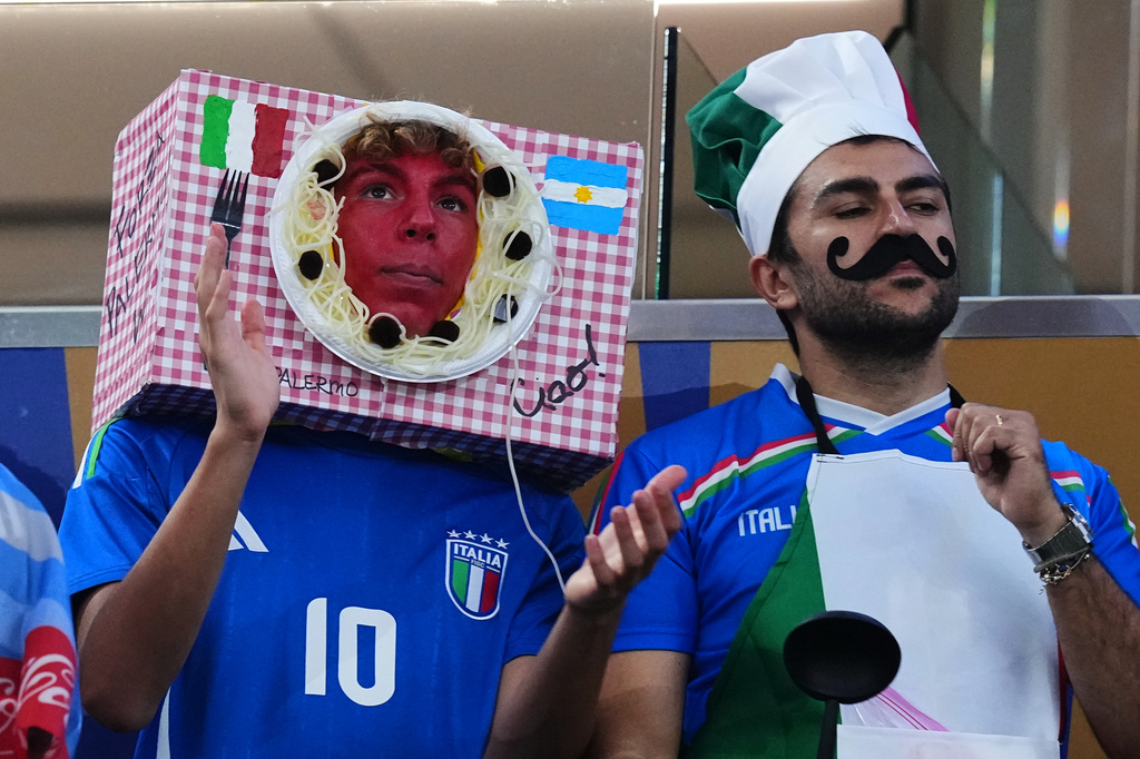 Spectators in costumes cheer ahead of the World Cup Group J soccer match between Jordan and Argentina in Arlington, Texas, near Dallas, Saturday, June 27, 2026. (AP Photo/Julio Cortez)