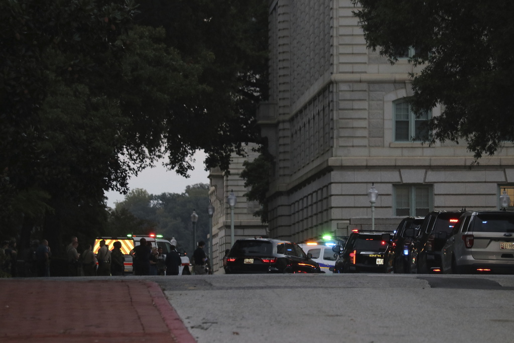 Law enforcement officers gather on the grounds of the U.S. Naval Academy in Annapolis, Md., Thursday, Sept. 11, 2025. (AP Photo/Brian Witte)