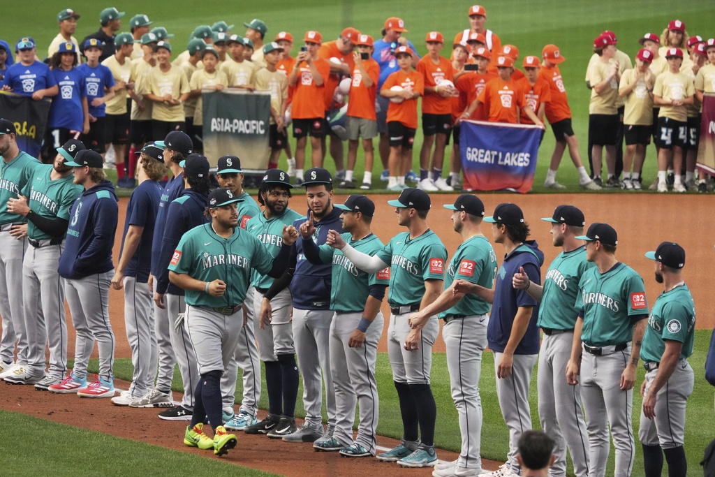 Seattle Mariners first base Josh Naylor is introduced before the Little League Classic baseball game against the New York Mets at Bowman Field in Williamsport, Pa., Sunday, Aug. 17, 2025. (AP Photo/Gene J. Puskar)