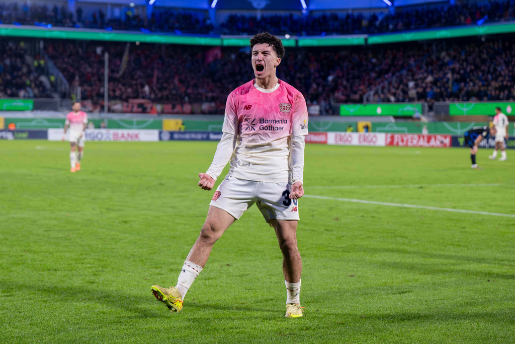 Leverkusen's Ibrahim Maza celebrates after scoring his side's third goal during a German soccer cup second round match between SC Paderborn and Bayer 04 Leverkusen in Paderborn, Germany, Wednesday, Oct. 29, 2025. (David Inderlied/dpa via AP)