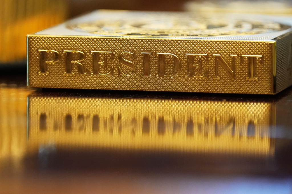 FILE - A gold-colored item embossed with the word 'President' sits on the Resolute desk in the Oval Office of the White House in Washington, Nov. 10, 2025. (AP Photo/Jacquelyn Martin, File)
