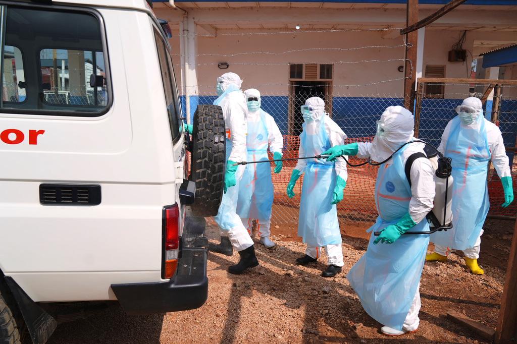 Health workers disinfects an ambulance at Ebola Treatment Center at Bunia General Hospital in Ituri, Congo, Wednesday, July 22, 2026. (AP Photo/Dirole Lotsima Dieudonne)