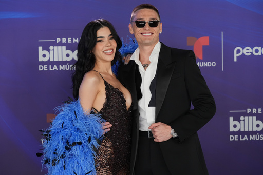 Kenia Os and Peso Luma arrive at the Latin Billboard Awards Thursday, Oct. 23, 2025, in Miami. (AP Photo/Marta Lavandier) Kenia Os and Peso Luma arrive at the Latin Billboard Awards Thursday, Oct. 23, 2025, in Miami. (AP Photo/Marta Lavandier)