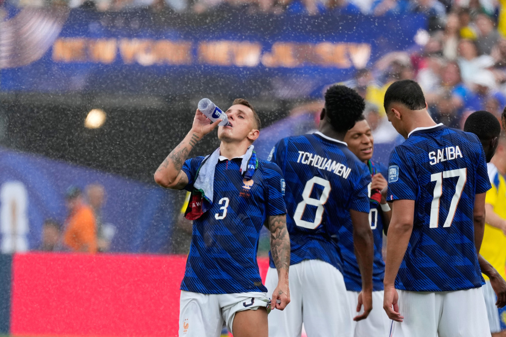 France's Lucas Digne cools during the hydration break during the World Cup round of 32 soccer match between France and Sweden in East Rutherford, N.J., near New York, Tuesday, June 30, 2026. (AP Photo/Seth Wenig)