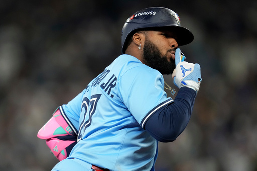 Toronto Blue Jays' Vladimir Guerrero Jr. celebrates after hitting a solo home run against the Seattle Mariners during the seventh inning in Game 4 of baseball's American League Championship Series, Thursday, Oct. 16, 2025, in Seattle. (AP Photo/Abbie Parr) Toronto Blue Jays' Vladimir Guerrero Jr. celebrates after hitting a solo home run against the Seattle Mariners during the seventh inning in Game 4 of baseball's American League Championship Series, Thursday, Oct. 16, 2025, in Seattle. (AP Photo/Abbie Parr)