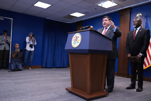 Governor JB Pritzker, second from right, speaks as Chicago Mayor Brandon Johnson, right, listens to him at a news conference in Chicago, Monday, Oct. 6, 2025. (AP Photo/Nam Y. Huh) Governor JB Pritzker, second from right, speaks as Chicago Mayor Brandon Johnson, right, listens to him at a news conference in Chicago, Monday, Oct. 6, 2025. (AP Photo/Nam Y. Huh)