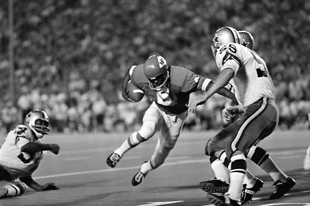FILE - Warren McVea (6) Kansas City Chiefs running back is stopped on an end run by Dallas Cowboy Leroy Jordan (55) in the first quarter action in Dallas, Sept. 5, 1970. (AP Photo/Fred Kaufman,File)