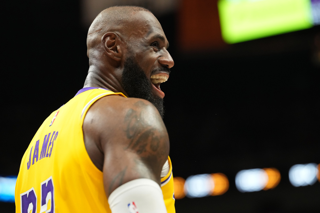 Los Angeles Lakers forward LeBron James smiles during the second half of an NBA basketball game against the Miami Heat, Thursday, March 19, 2026, in Miami. (AP Photo/Lynne Sladky)