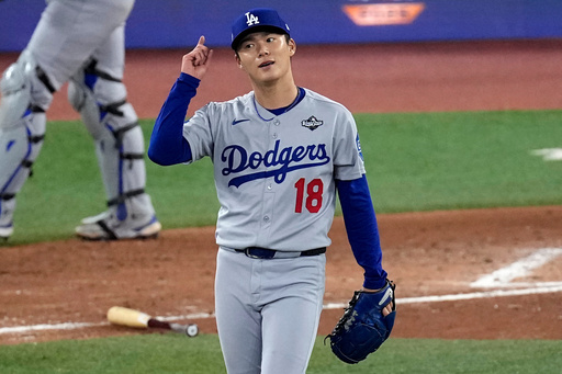 Los Angeles Dodgers' pitcher Yoshinobu Yamamoto celebrates his complete game after Game 2 of baseball's World Series against the Toronto Blue Jays, Saturday, Oct. 25, 2025, in Toronto. (AP Photo/David J. Phillip) Los Angeles Dodgers' pitcher Yoshinobu Yamamoto celebrates his complete game after Game 2 of baseball's World Series against the Toronto Blue Jays, Saturday, Oct. 25, 2025, in Toronto. (AP Photo/David J. Phillip)