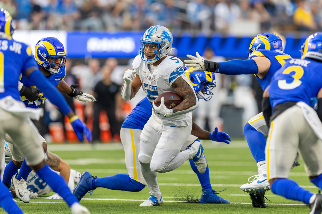 FILE - Detroit Lions running back David Montgomery (5) runs the ball against the Los Angeles Rams in an NFL football game, Dec. 14, 2025, in Inglewood, Calif. (AP Photo/Jeff Lewis, File)