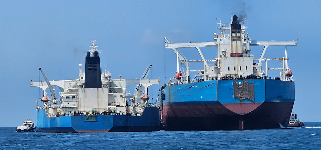 This handout photo from United Against Nuclear Iran shows two oil tankers making a ship-to-ship transfer of Iranian oil in the Eastern Outer Port Limits (EOPL), 70 kilometers off Malaysia's coast in international waters on 28 July 2025. (Charlie Brown/United Against Nuclear Iran via AP)
