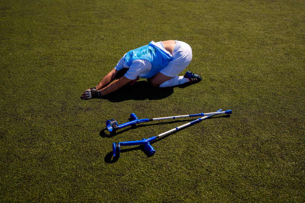 Panathinaikos' Vasileios Gogolos stretches during an amputee soccer match between Maccabi Haifa and Panathinaikos in the inaugural EAFF Conference League in Bucharest, Romania, Thursday, Sept. 24, 2026. (AP Photo/Andreea Alexandru)