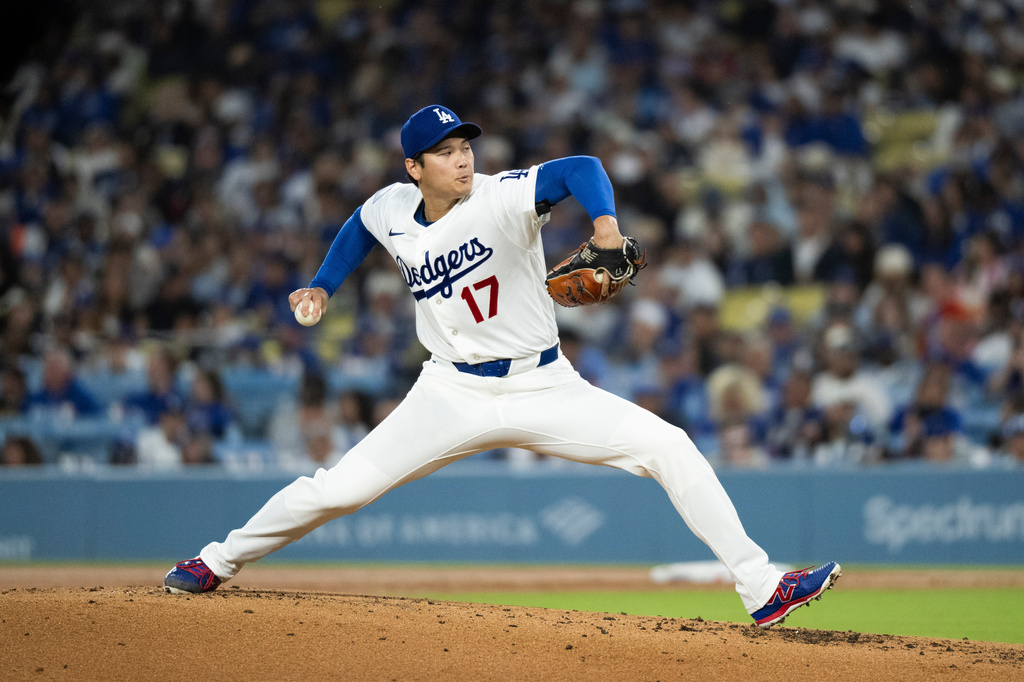 Los Angeles Dodgers starting pitcher Shohei Ohtani delivers during the second inning of a baseball game against the Cleveland Guardians in Los Angeles, Tuesday, March 31, 2026. (AP Photo/Kyusung Gong)