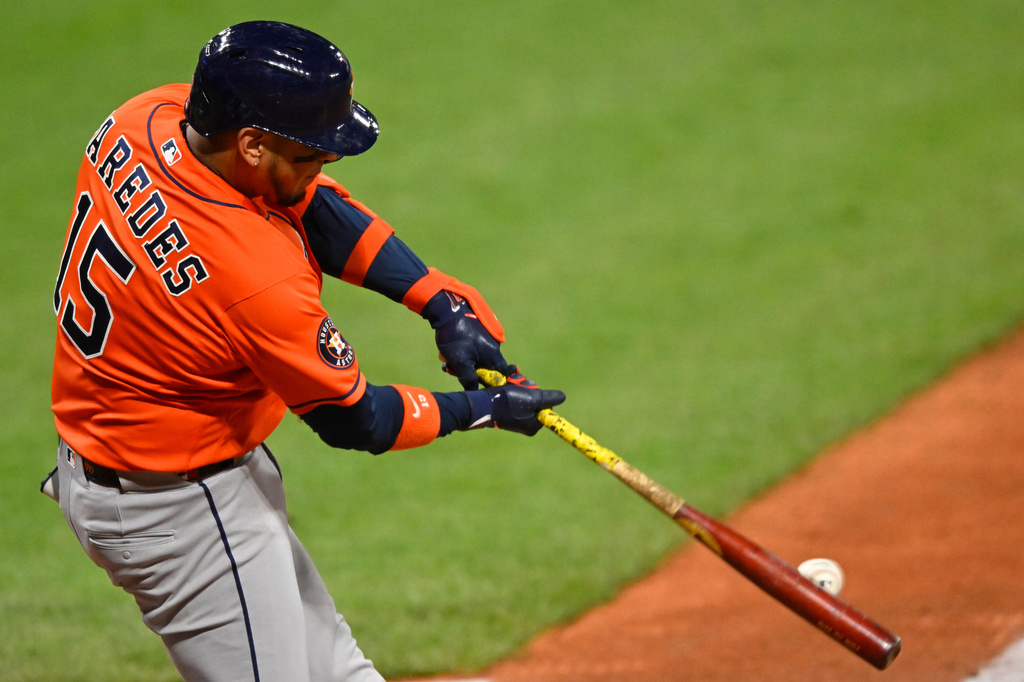 Houston Astros' Isaac Paredes hits a solo home run in the ninth inning of a baseball game against the Cleveland Guardians in Cleveland, Monday, April 20, 2026. (AP Photo/David Richard)