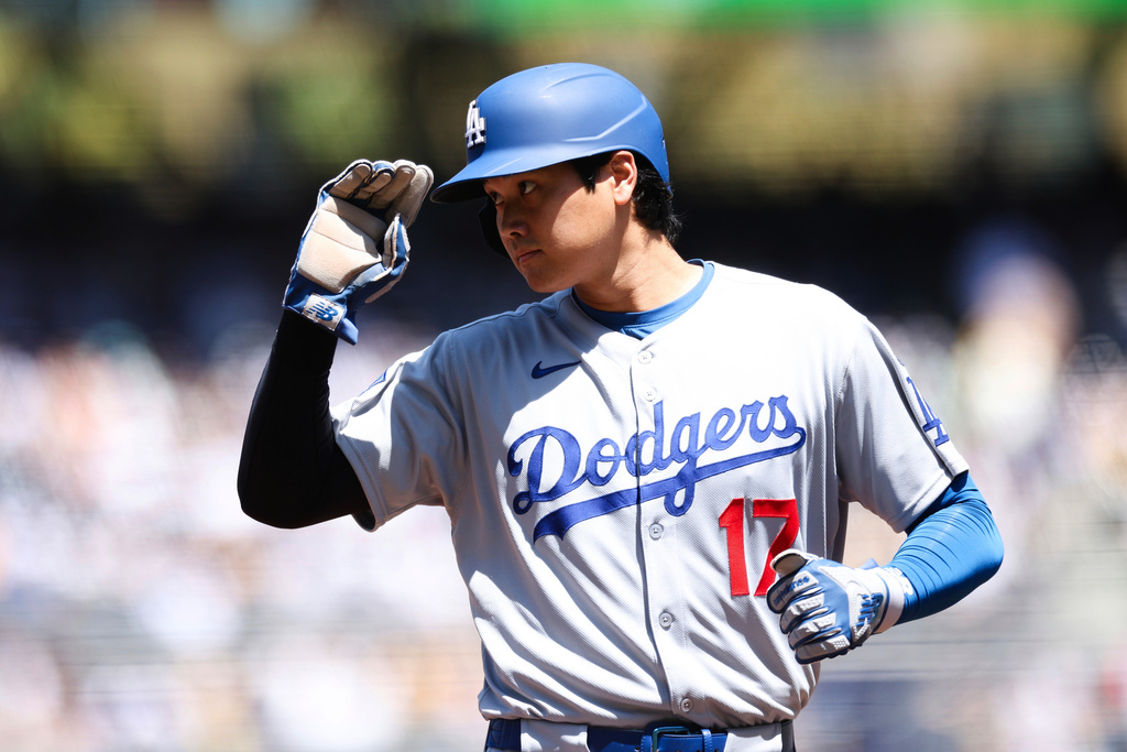 Los Angeles Dodgers' Shohei Ohtani gestures during the first inning of a baseball game against the San Diego Padres, Sunday, Aug. 24, 2025, in San Diego. (AP Photo/Derrick Tuskan)