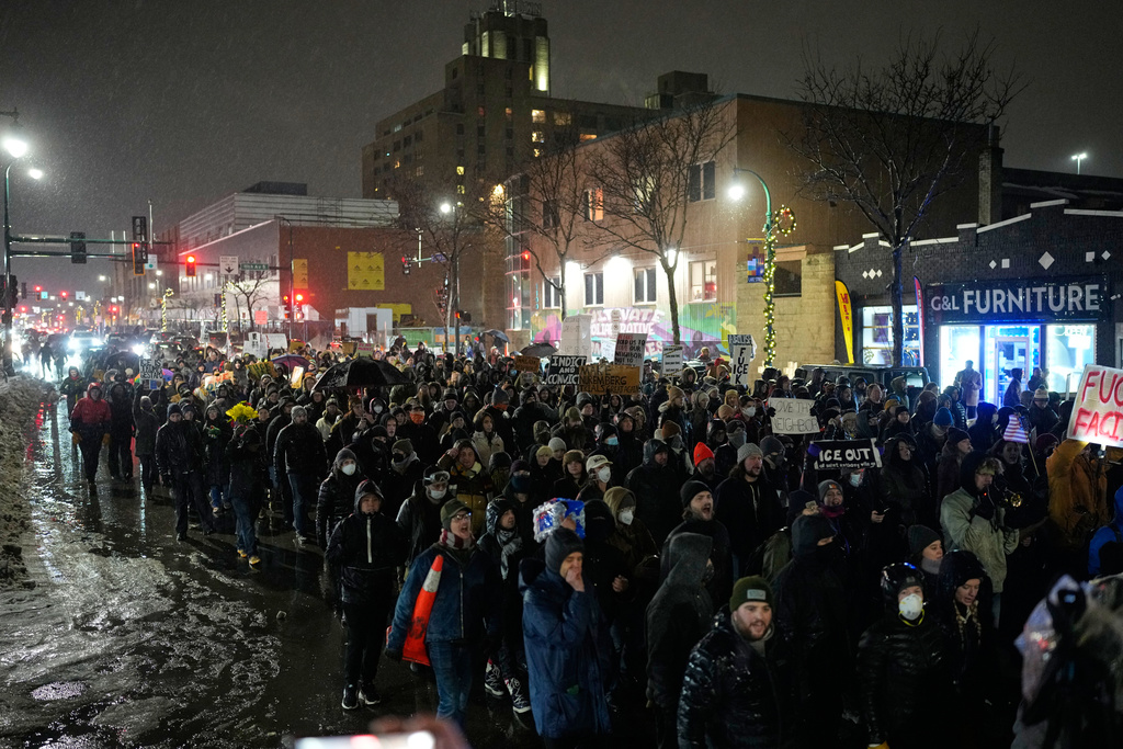 Protesters chant and march during a rally for Renee Good, who was fatally shot by an ICE officer the day before, Thursday, Jan. 8, 2026, in Minneapolis. (AP Photo/John Locher)