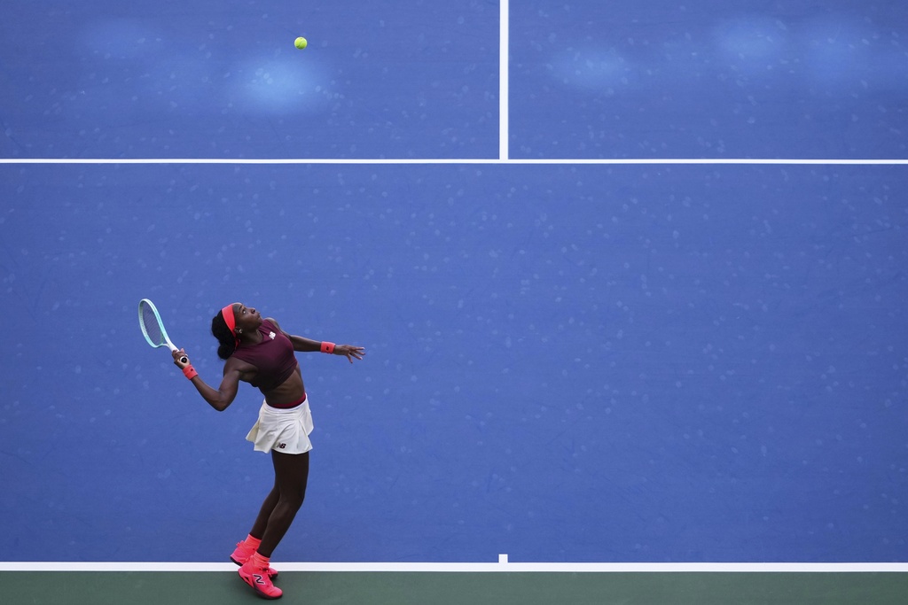 Coco Gauff, of the United States, serves during the third round of the U.S. Open tennis championships, Saturday, Aug. 30, 2025, in New York. (AP Photo/Kirsty Wigglesworth)