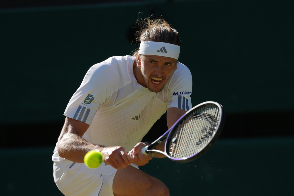 Alexander Zverev of Germany returns the ball to Marcos Giron of the United States in their third round men's singles match at the Wimbledon Tennis Championships in London, Saturday, July 4, 2026. (AP Photo/Kirsty Wigglesworth)