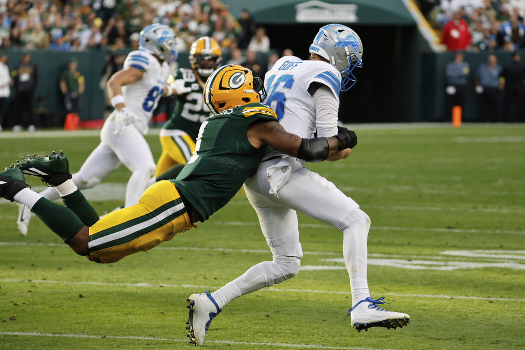 Green Bay Packers defensive end Micah Parsons (1) sacks Detroit Lions quarterback Jared Goff (16) during the second half of an NFL football game Sunday, Sept. 7, 2025, in Green Bay, Wis. (AP Photo/Mike Roemer)
