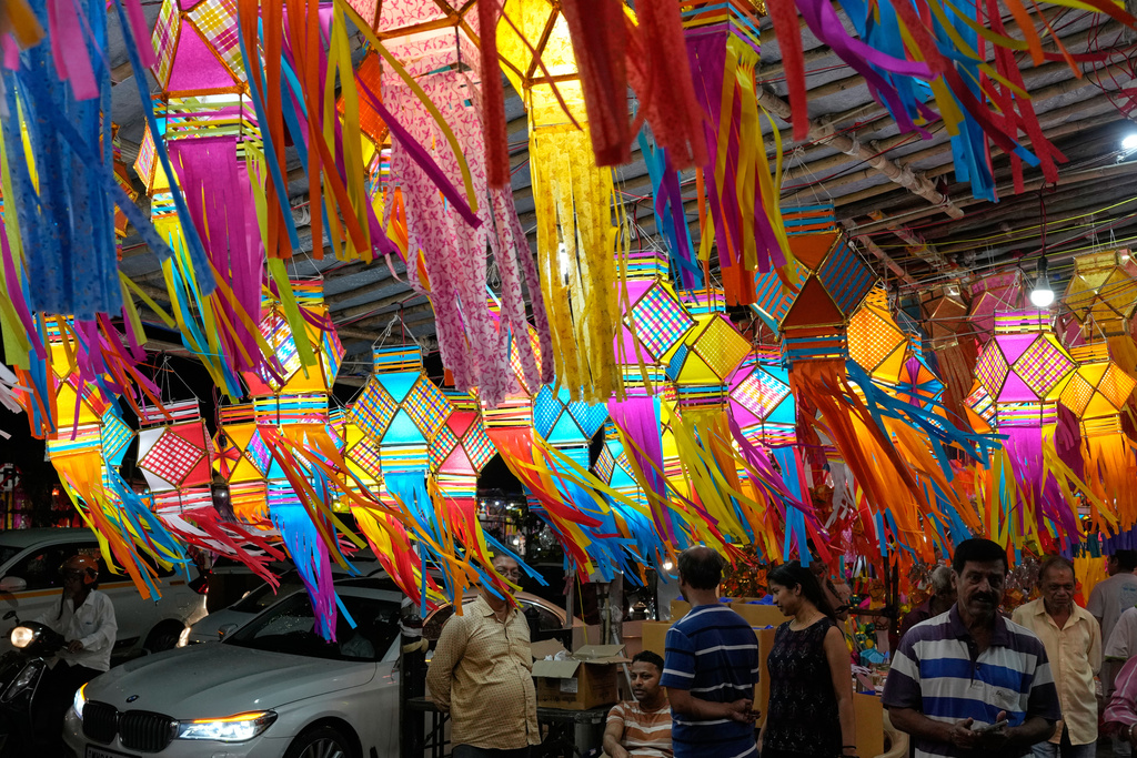 Lanterns are displayed for sale at roadside stalls as people shop ahead of Diwali festival in Mumbai, India, Thursday, Oct. 16, 2025. (AP Photo/Rajanish Kakade)