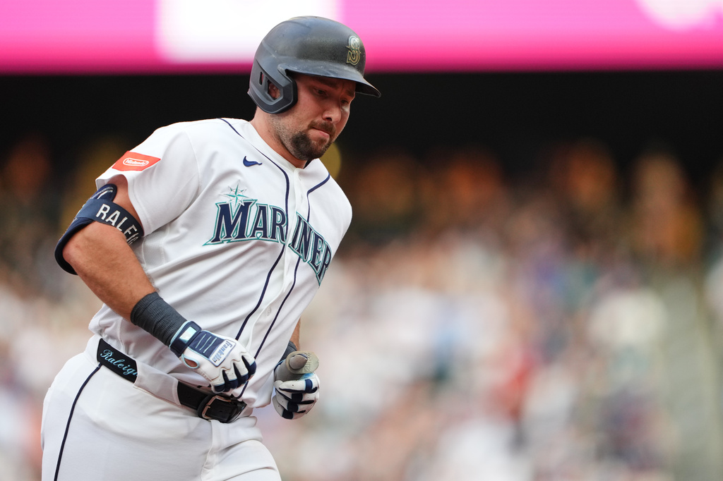 Seattle Mariners' Cal Raleigh jogs the bases after hitting a solo home run against the Philadelphia Phillies during the second inning of a baseball game, Tuesday, Aug. 25, 2026, in Seattle. (AP Photo/Lindsey Wasson)