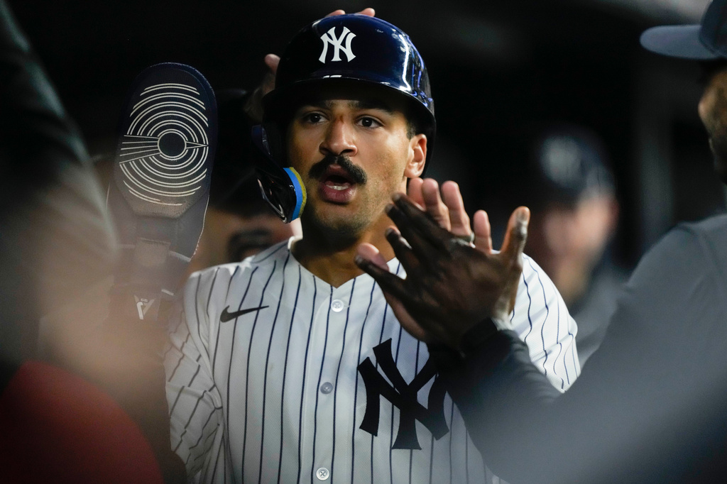 New York Yankees' Trent Grisham celebrates with teammates after scoring on a sacrifice fly hit by Yankees' Cody Bellinger during the third inning of a baseball game against Baltimore Orioles, Monday, May 4, 2026, in New York. (AP Photo/Yuki Iwamura)