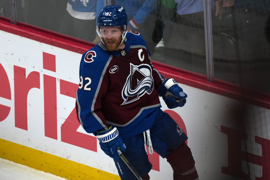 Colorado Avalanche left wing Gabriel Landeskog reacts after scoring a goal against the Vegas Golden Knights during the third period in Game 1 of the Western Conference finals NHL hockey Stanley Cup playoff series Wednesday, May 20, 2026, in Denver. (AP Photo/David Zalubowski)
