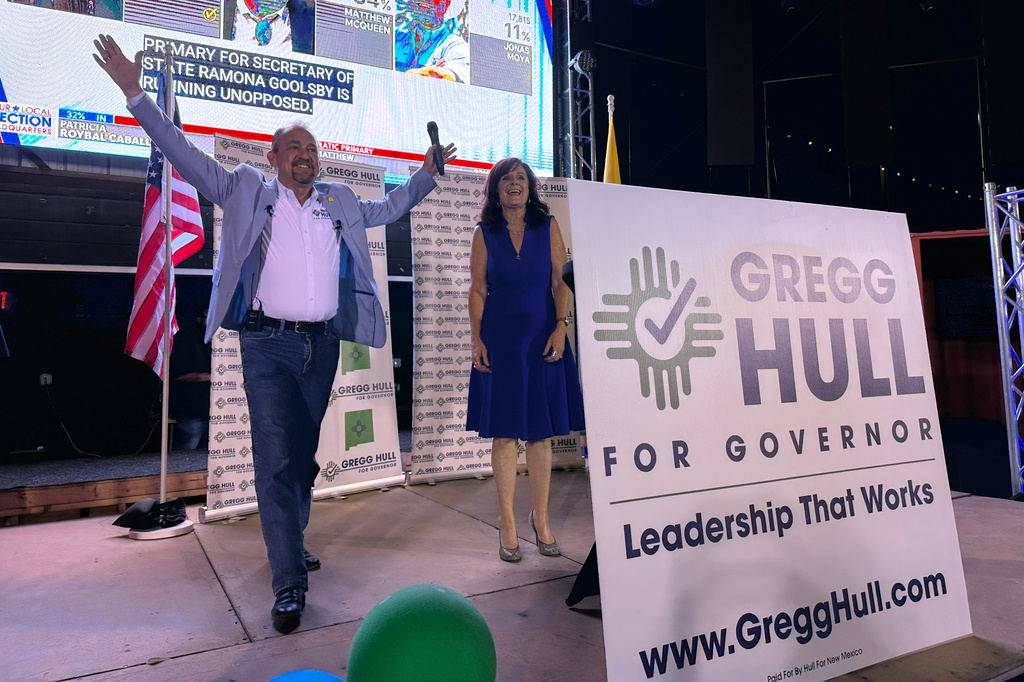 Republican gubernatorial nominee Gregg Hull and his wife Carrie take the stage as he claims victory in the primary during a watch party in Albuquerque, New Mexico, on Tuesday, June 2, 2026. (AP Photo/Susan Montoya Bryan)