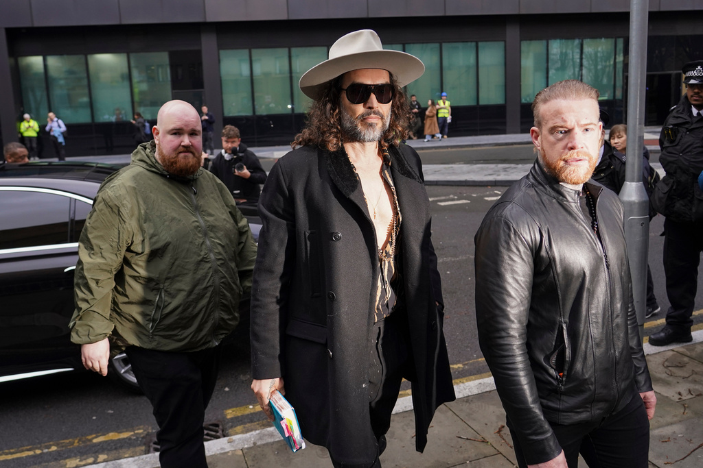 Russell Brand arrives at Southwark Crown Court, in London, Tuesday, Feb. 24, 2026. (AP Photo/Alberto Pezzali)