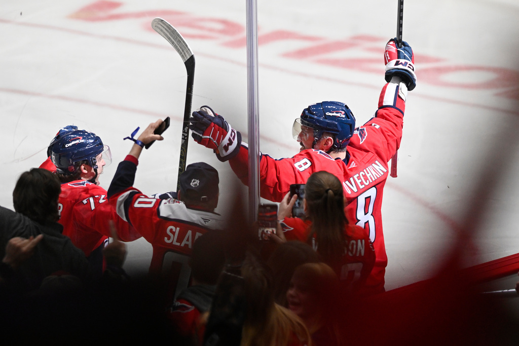 Washington Capitals left wing Alex Ovechkin (8) celebrates his 900th NHL career goal against the St. Louis Blues during the second period of an NHL hockey game, Wednesday, Nov. 5, 2025, in Washington. (AP Photo/John McDonnell)