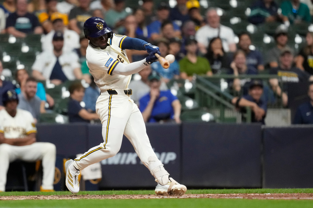 Milwaukee Brewers' Luis Lara hits a three-run home run for his first career home run during the eighth inning of a baseball game against the Seattle Mariners, Tuesday, Aug. 18, 2026, in Milwaukee. (AP Photo/Aaron Gash)
