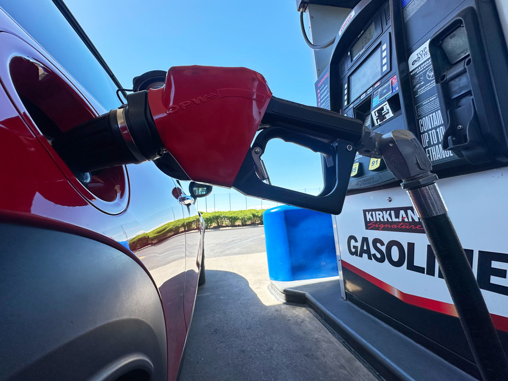 FILE - A motorist fills up the tank of a vehicle at a Costco gasoline station Wednesday, April 15, 2026, in Sheridan, Colo. (AP Photo/David Zalubowski, file)