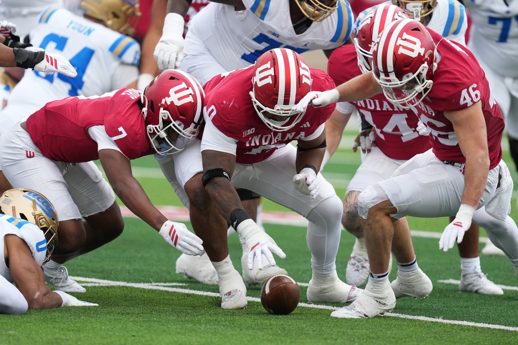 Indiana defensive lineman Hosea Wheeler (0) recovers a fumble during the first half of an NCAA college football game against UCLA, Saturday, Oct. 25, 2025, in Bloomington, Ind. (AP Photo/Darron Cummings)