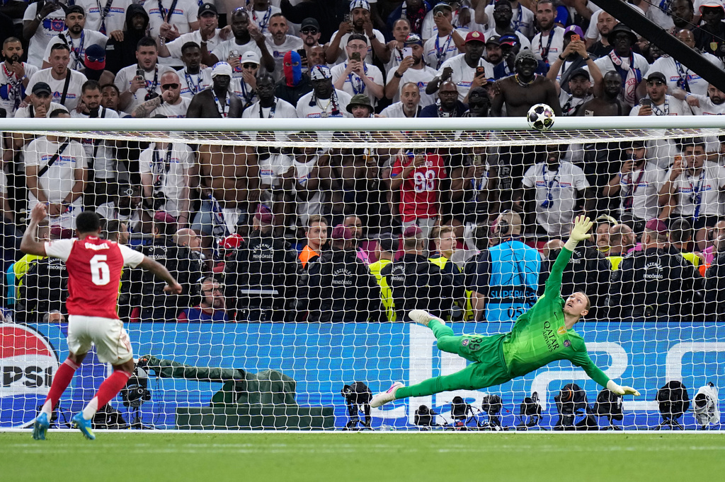 Arsenal's Gabriel Magalhaes shoots over the bar during a penalty shootout after extra time during the Champions League final soccer match between Paris Saint-Germain and Arsenal in Budapest, Hungary, Saturday, May 30, 2026. (AP Photo/Petr Josek)
