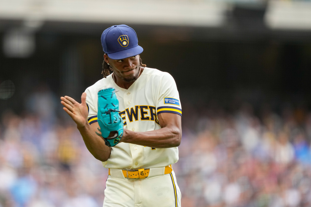 Milwaukee Brewers pitcher Abner Uribe reacts to the final out of the eighth inning made by second baseman Brice Turang in a baseball game against the New York Mets Wednesday, July 22, 2026, in Milwaukee. (AP Photo/Kayla Wolf)