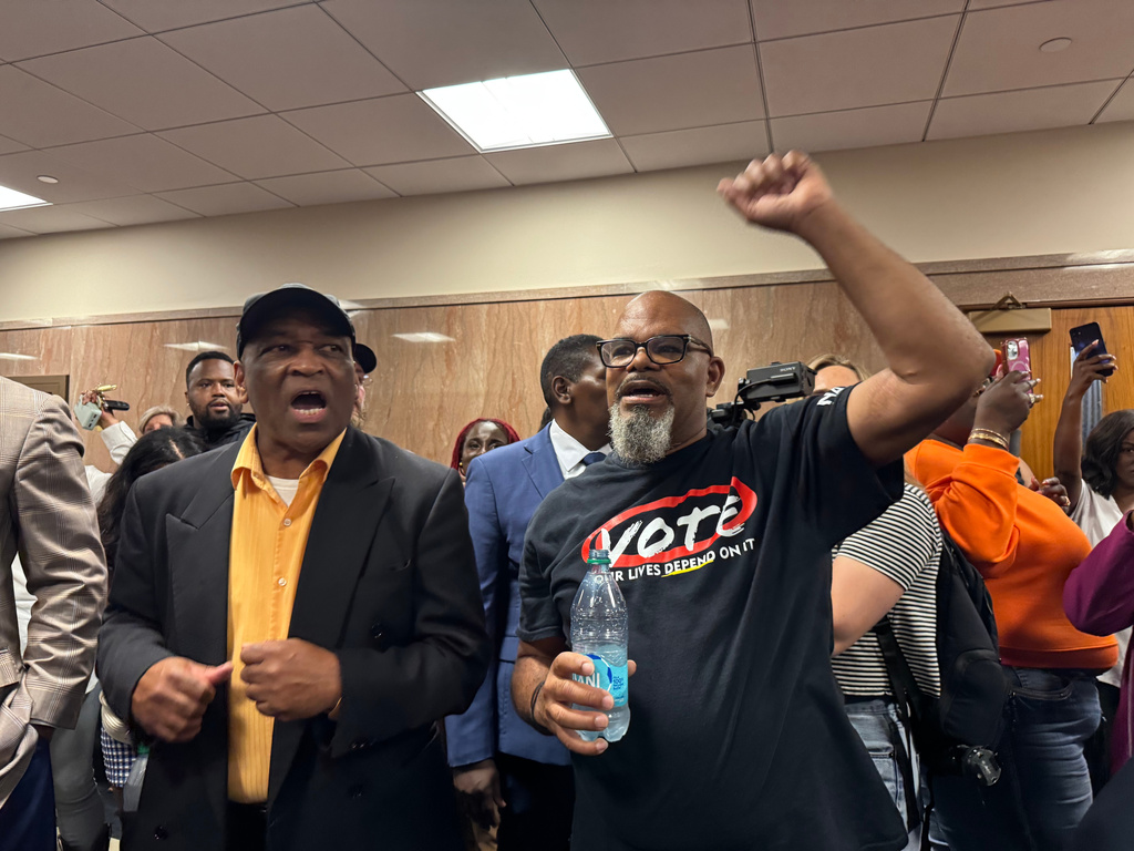Protestors fill the halls in the Louisiana Legislature in Baton Rouge during a Senate committee hearing Friday, May 8, 2026 on redistricting. (AP Photo/Jack Brook)