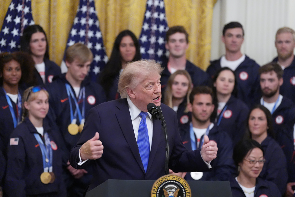 President Donald Trump speaks during an event for Olympic winter athletes, coaches, staff, and representatives from Team USA in the East Room of the White House, Thursday, Aug. 6, 2026, in Washington. (AP Photo/Alex Brandon)