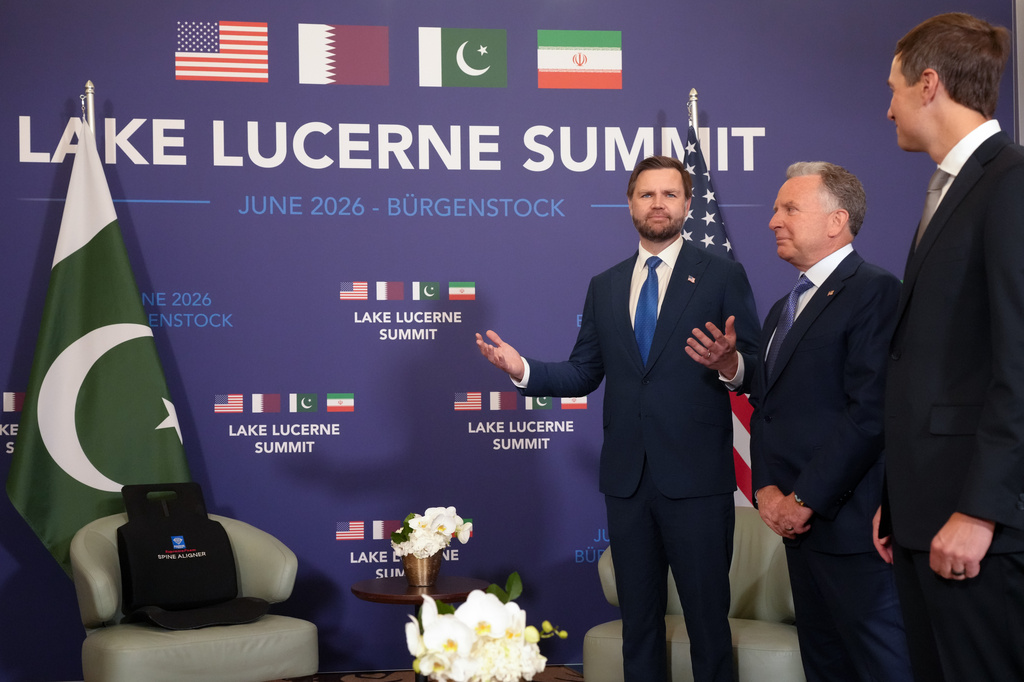 U.S. Vice President JD Vance, left, reacts next to U.S. President Donald Trump's envoys Steve Witkoff, second right, and Jared Kushner, right, while waiting to meet with Pakistan's Prime Minister Shehbaz Sharif for high-level talks aimed at advancing a deal to end the Middle East conflict, at the Bürgenstock Resort in Obbuergen, near Lucerne, in Switzerland, Sunday, June 21, 2026. (Nathan Howard/Pool Photo via AP)