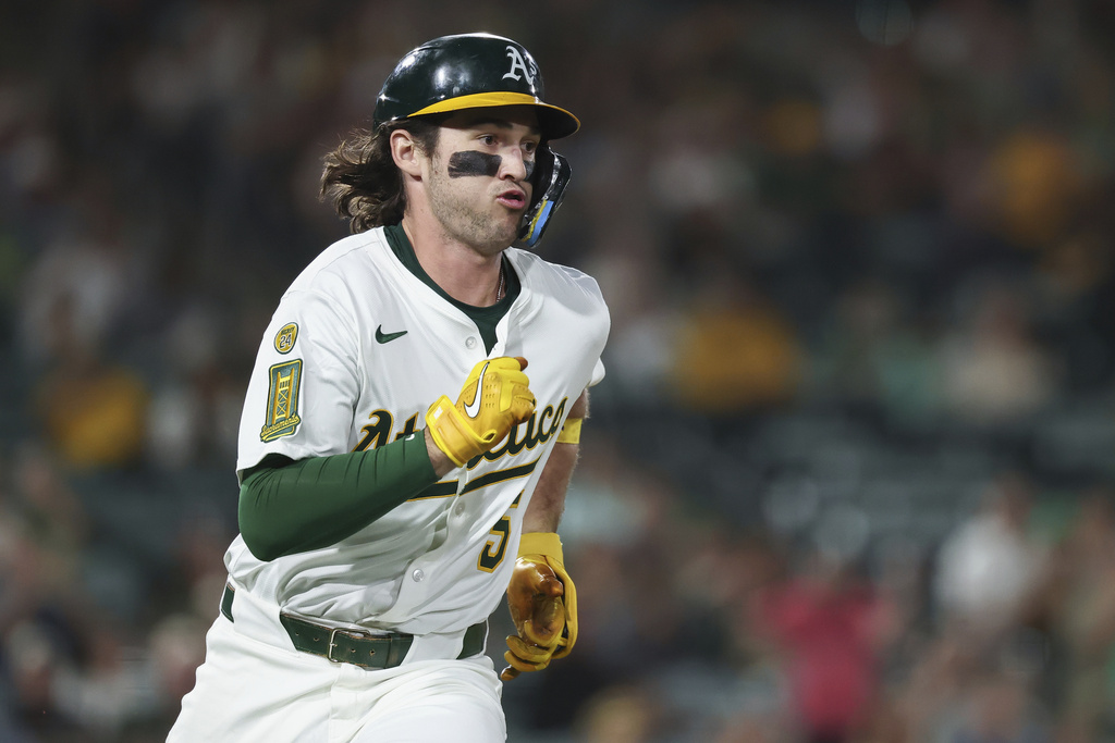 Athletics' Jacob Wilson runs after hitting an RBI double during the third inning of a baseball game against the Cincinnati Reds, Saturday, Sept. 13, 2025, in West Sacramento, Calif. (AP Photo/Sara Nevis)