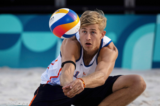 FILE - Netherlands' Steven Van De Velde hits the ball during the men's Pool B beach volleyball match between Norway and the Netherlands at Eiffel Tower Stadium at the 2024 Summer Olympics, Aug. 2, 2024, in Paris, France. (AP Photo/Louise Delmotte, File) FILE - Netherlands' Steven Van De Velde hits the ball during the men's Pool B beach volleyball match between Norway and the Netherlands at Eiffel Tower Stadium at the 2024 Summer Olympics, Aug. 2, 2024, in Paris, France. (AP Photo/Louise Delmotte, File)