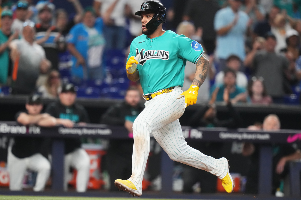 Miami Marlins' Agustin Ramirez runs to score on a single hit by Xavier Edwards during the sixth inning of a baseball game against the Washington Nationals, Sunday, Aug. 23, 2026, in Miami. (AP Photo/Lynne Sladky)