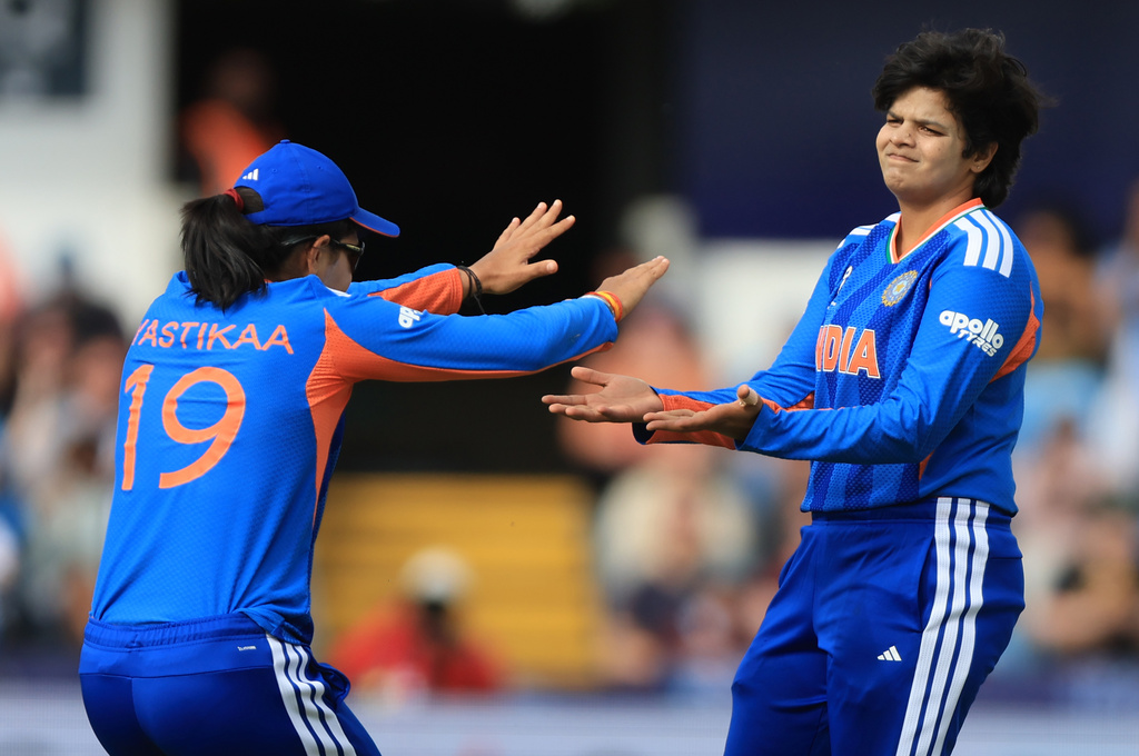 India's Shafali Verma, right, celebrates the wicket of Netherlands Sterre Kalis during the Women's T20 World Cup cricket match in Leeds, England, Wednesday, June 17, 2026. (Nigel French/PA via AP)