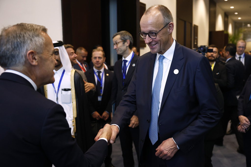 German Chancellor Freidrich Merz meets meets Canadian Prime Minister Mark Carney, left, at the Gaza International Peace Summit, in Sharm el-Sheikh, Egypt, Monday, Oct.13 2025. (Yoan Valat, Pool photo via AP)