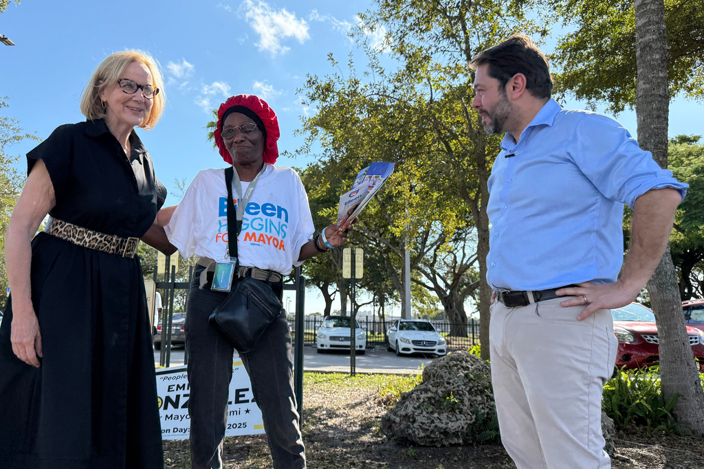Senator Ruben Gallego, right, campaigns with Eileen Higgins during her campaign for Miami Mayor on Sunday, Dec. 7, 2025 in Miami. (AP Photo/Adriana Gomez)