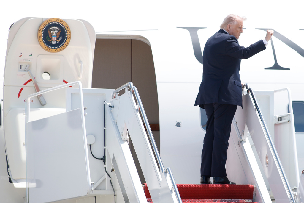 President Donald Trump gestures as he boards Air Force One, Friday, May 1, 2026, at Joint Base Andrews, Md. (AP Photo/Luis M. Alvarez)
