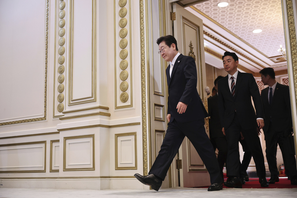 South Korean President Lee Jae Myung arrives for his news conference to mark 100 days in office at the Blue House in Seoul, South Korea, Sept, 11, 2025. (Kim Hong-Ji/Pool Photo via AP)