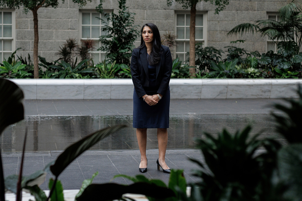 Anam Petit, a former Justice Department employee, poses for a portrait in the Robert and Arlene Kogod Courtyard at the National Portrait Gallery in Washington, Friday, Jan. 9, 2026. (AP Photo/Moriah Ratner)