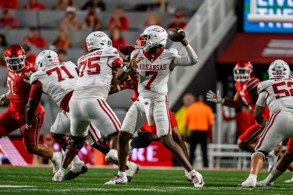 Arkansas quarterback KJ Jackson (7) looks to pass during the second half of an NCAA college football game against Utah, Saturday, Sept. 12, 2026, in Salt Lake City. (AP Photo/Tyler Tate)