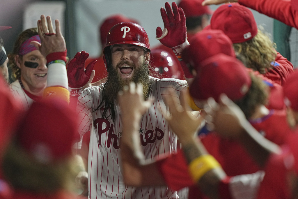 Philadelphia Phillies' Brandon Marsh celebrates after hitting a home run off of Kansas City Royals pitcher Taylor Clarke during the seventh inning of a baseball game, Saturday, Sept. 13, 2025, in Philadelphia. (AP Photo/Matt Rourke)