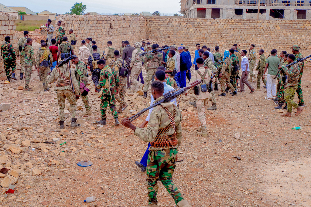 Government troops patrol alongside government officials after clashes with militias that killed dozens of people, including civilians, in Baidoa, Somalia, Monday, Aug. 17, 2026. (AP Photo)